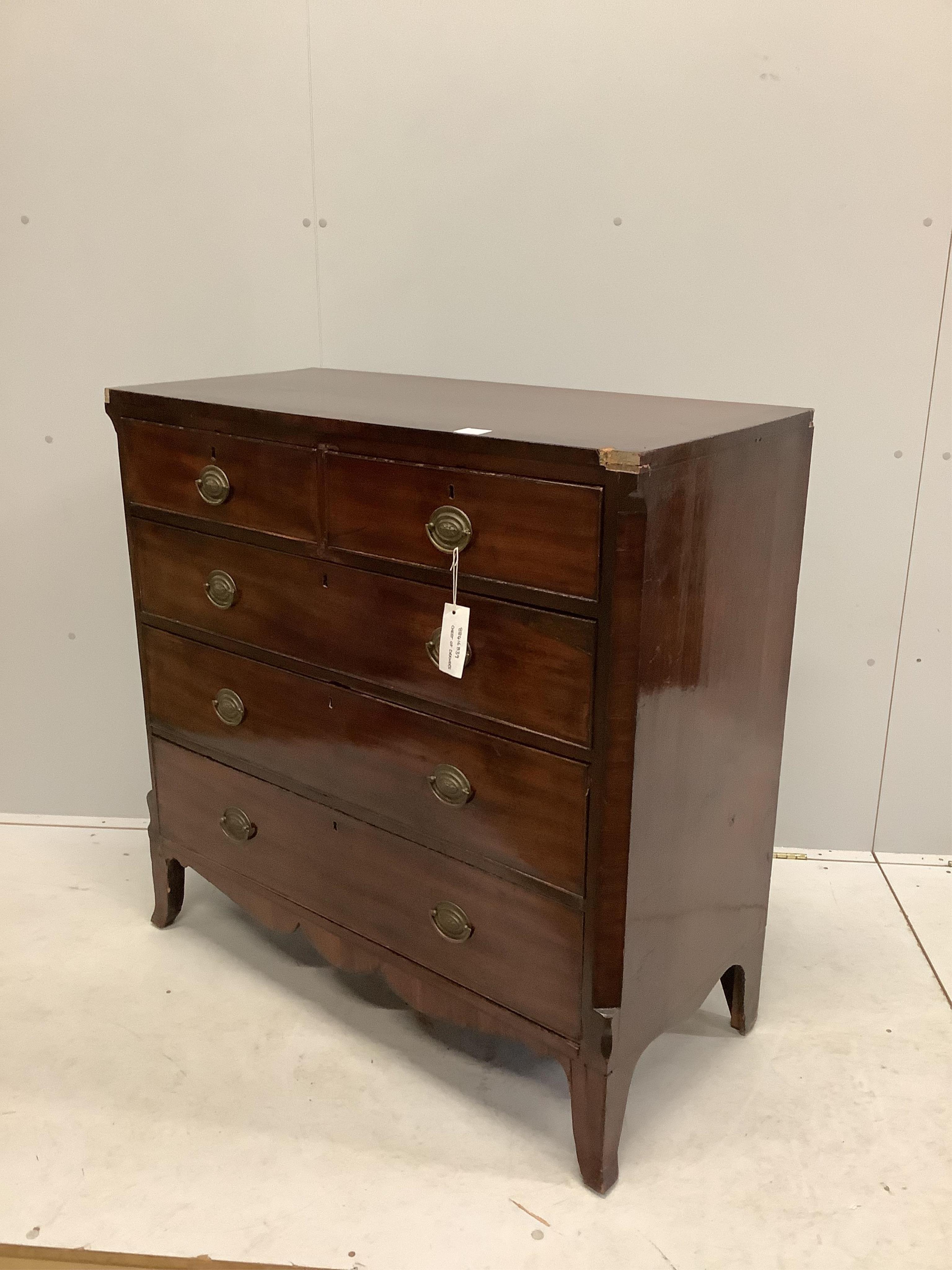 An early Victorian crossbanded mahogany chest of two short and three long drawers, with brass oval loop handles, width 105cm, depth 48cm, height 104cm. Condition - poor to fair